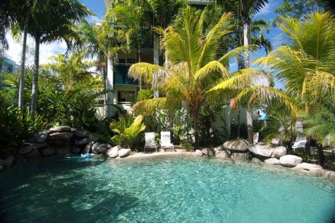Pool surrounded by lush gardens - Verandahs Boutique Apartments